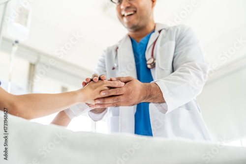 Male doctor visiting female cancer patient with care and compassion in hospital room. Oncology support medical consultation healthcare and hope. Doctor reporting medical test results to the patient