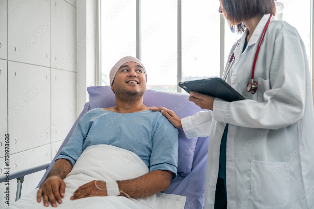 Obraz premium A male cancer patient in a wheelchair receives IV therapy while a female doctor offers care encouragement and updates on his test results providing support and discussing health progress