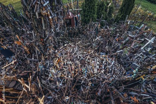 Pile of crosses on Kryziu kalnas - Hill of Crosses - famous pilgrimage site near Siauliai city, Lithuania