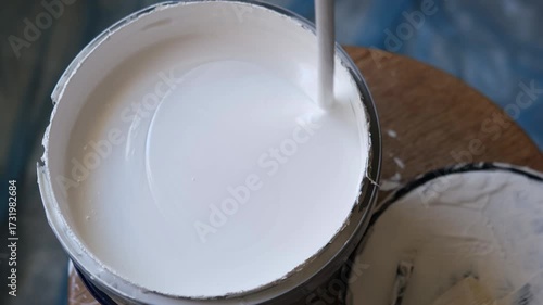 diy wall painting and hoöe interior renovation, mixing, prepairing, brush into paint