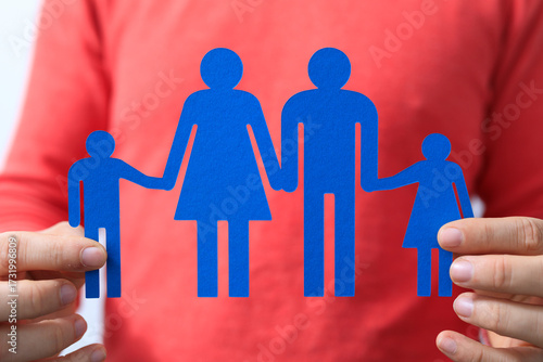 Person holding a paper cuto...