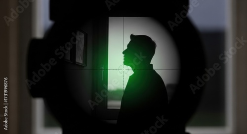Man silhouette in sniper scope. Target view of a head. Concept of danger and hunting.