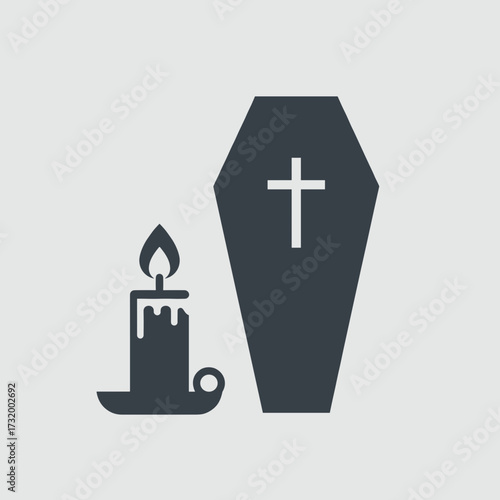 Funeral candle next to coffin with cross symbol  
