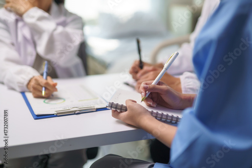 Medical Team Meeting, Doctors Taking Notes During Briefing Session