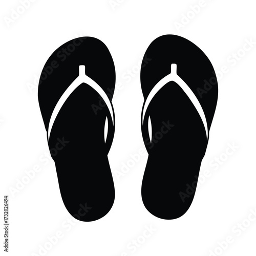 Pair of simple black flip flops isolated on a white background