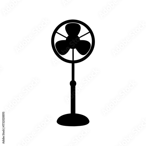 Silhouette of a vintage style standing fan providing coolness on a hot day