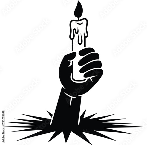 Fist holding a burning candle emerging from the ground