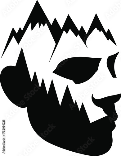 Silhouette of a face with a mountain range emerging from the head