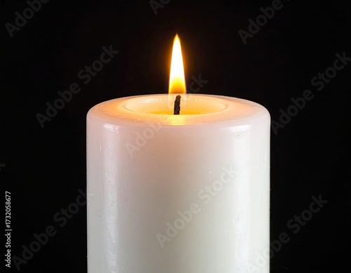 Single white candle, flame, black background