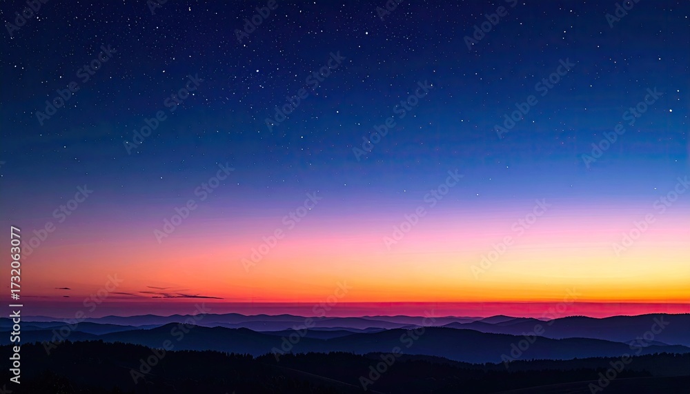 Fototapeta premium Night sky meets colorful sunrise over misty mountains