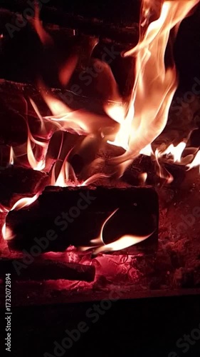 fire burning at night in fire pit super slow motion video
