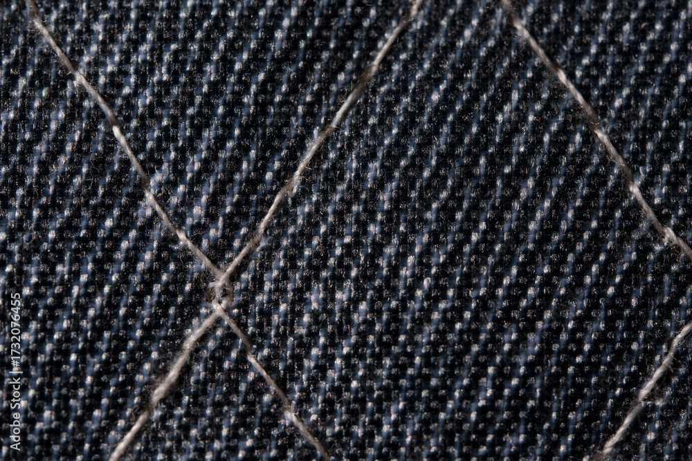 Naklejka premium Closeup of Quilted Dark Denim Fabric Texture
