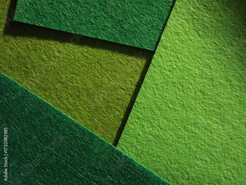 The textured surface is green, light green, pistachio color, herbal color as a background. Felt. High quality photo