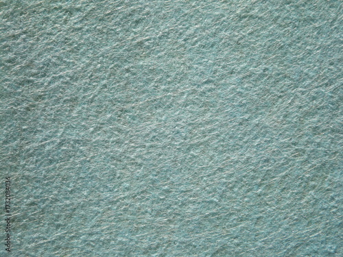 The textured surface is blue as a background. Felt. High quality photo
