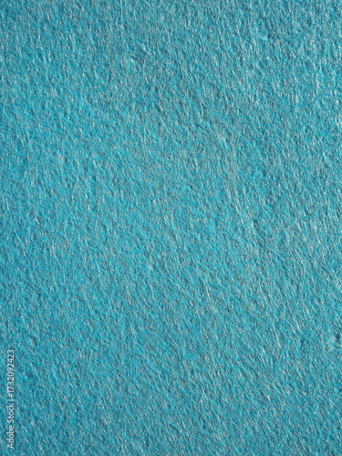 The textured surface is blue as a background. Felt. High quality photo