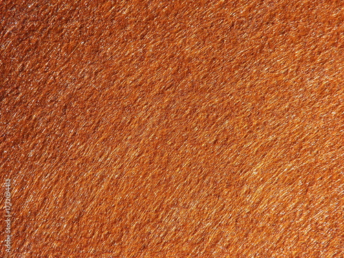 The textured surface is brown, red in color as a background. Felt. High quality photo