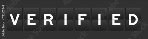 Black color analog flip board with word verified on gray background