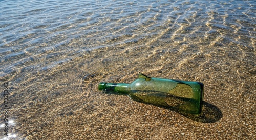 Close Up Scenic Broken Green Glass Bottle on Sandy Beach