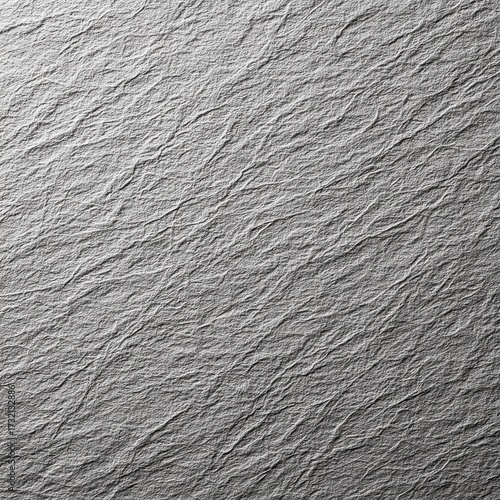 Crumpled grey paper texture abstract background design