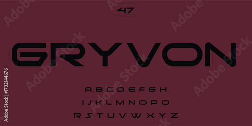 Modern sans serif font gryvon displayed with alphabet characters on a dark red background