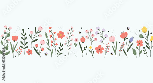 A delightful display of wild meadow flowers in bloom with a light green background.