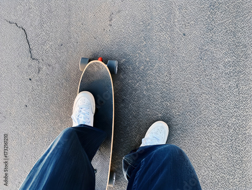 Pov View of White Sneakers on Longboard Cruising on Concrete Ground
