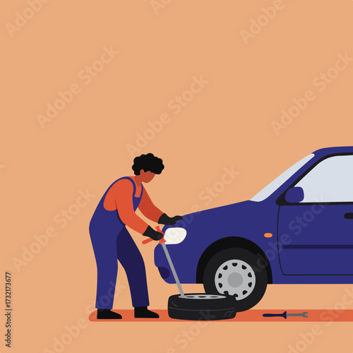 Mechanic changes tire of a blue car on a peach background, using a jack and tools