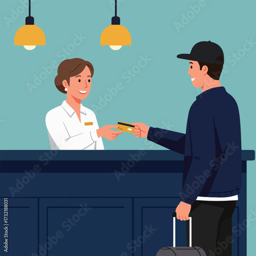 Hotel receptionist takes payment card from guest with luggage at reception