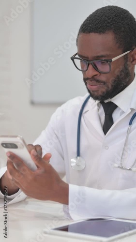 African Doctor Engaged in Telemedicine Call via Phone