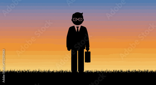 Silhouette of a businessman in a suit with glasses and a briefcase standing on grass against a sunset sky