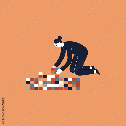 Woman kneeling, building with square tiles against a peach background