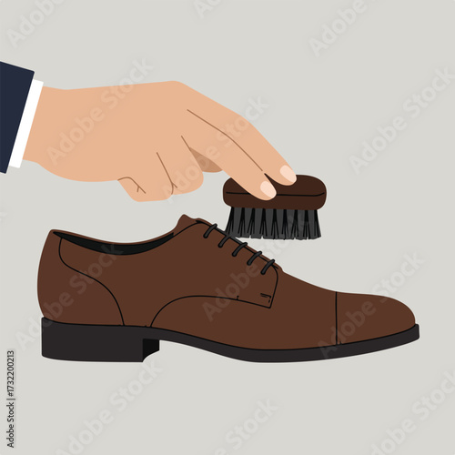 Shoe cleaning Hand brushes a brown leather shoe