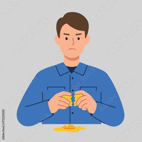 Angered man breaks an egg over table, yolk spills