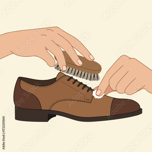 Hands polish a brown leather shoe using a brush and cloth