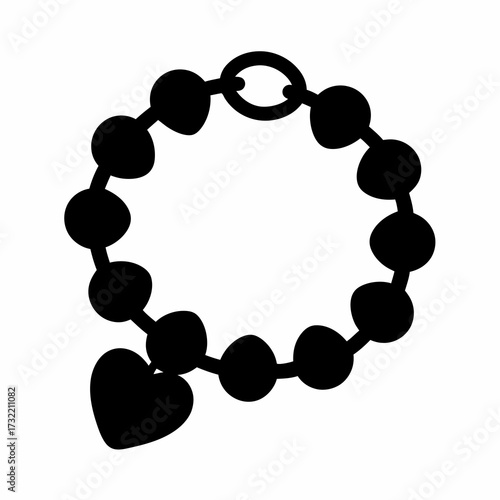 Stylized black and white bracelet with spherical beads and heart charm