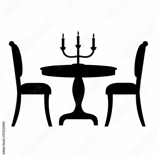 Elegant dining arrangement featuring a round table, two chairs, and candelabra