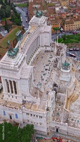  Aerial view of the national Monument to Victor Emmanuel II in city of Rome. Establishing shot of the Altare della Patria in Piazza Venezia. Famous iconic monument of the historic center of Rome