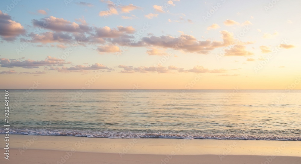 Obraz premium Serene coastal view at golden hour, featuring calm ocean waters, a soft sandy beach, and a sky with delicate pastel clouds, evoking peace and relaxation