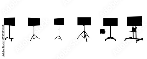 Set Of Black Monitor Stands With Screens On Tripods In A Studio Silhouette Series