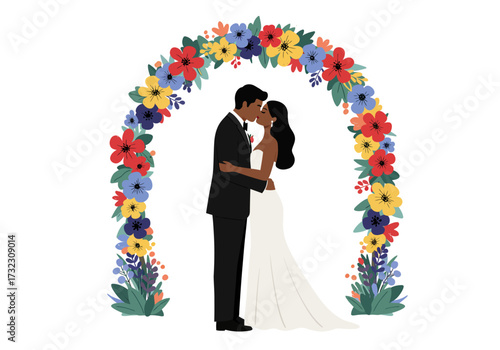 A kissing couple stands under an arch decorated with colorful flowers in front of a white background