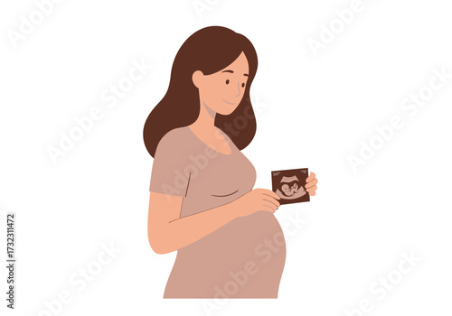 Pregnant woman holding ultrasound looking down smiling slightly in a neutral background