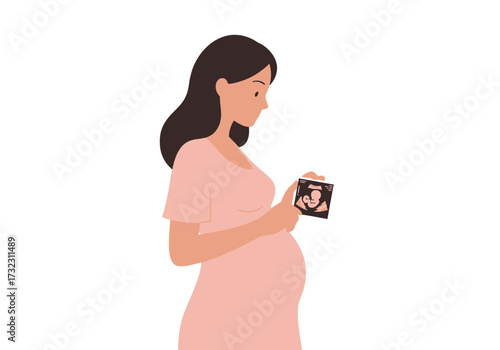 Pregnant woman gazes at ultrasound