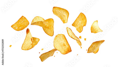 A dynamic arrangement of golden. crispy potato chips scattered against a clean white background. their texture and shape. ideal for food-related content or snack advertisements