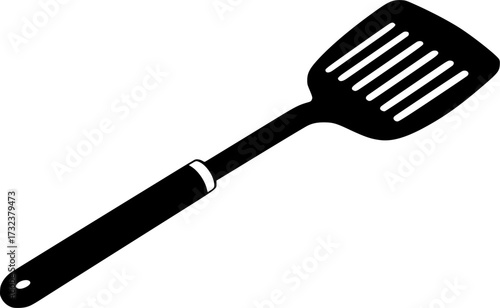 Black silhouette of a slotted spatula kitchen utensil isolated on white background
