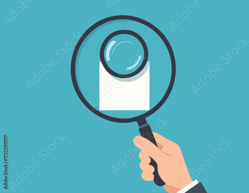 Hands holding magnifying glass for data analysis