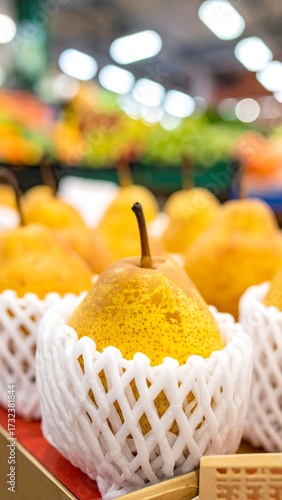 Wallpaper Mural Close-up of yellow pears in protective netting Torontodigital.ca
