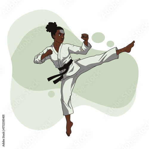 Athletic dark-skinned woman in white karate gi executes a dynamic side kick with determination. Concept for martial arts training, self-defense instruction and competitive sports promotion