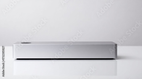 Wallpaper Mural Minimalist communication device with a sleek design and polished surface on a neutral backdrop. Torontodigital.ca