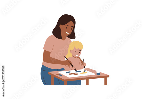 A woman  child paint at a table The woman is behind the child assisting the child in painting something