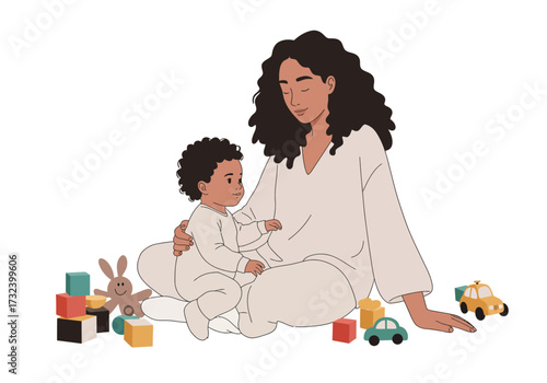 Mother and child sit surrounded by toys